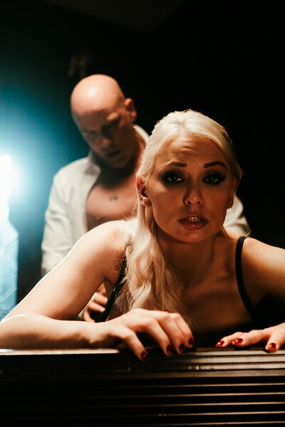 Dr. Charlie Hayes uses her feminine wiles on Warden Marc, who cannot resist her.