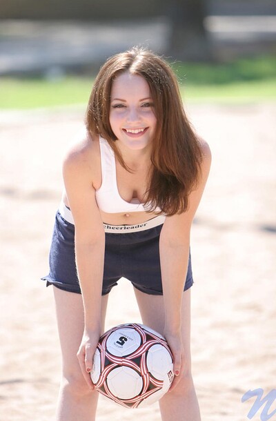 Hottie's out there in her little shorts and tee, smacking a soccer ball like it's a volleyball, 'cause that's just how she rolls.