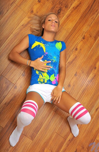 Horny chick spread wide on the ground, giving a sick view of her tight, young body.