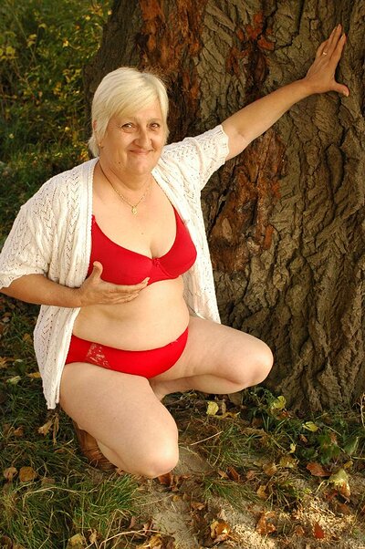 Granny Anna Mary deepthroats a massive dick while receiving intense doggy style fucking outside.