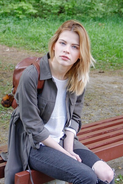 A sad babe on a park bench is approached by a dude who fucks her.