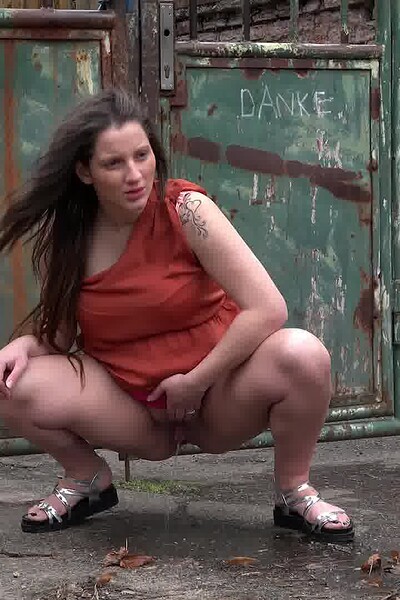 Nicolette Noir squats and sprays her pregnant piss over the ground, careful not to soak her sandals.