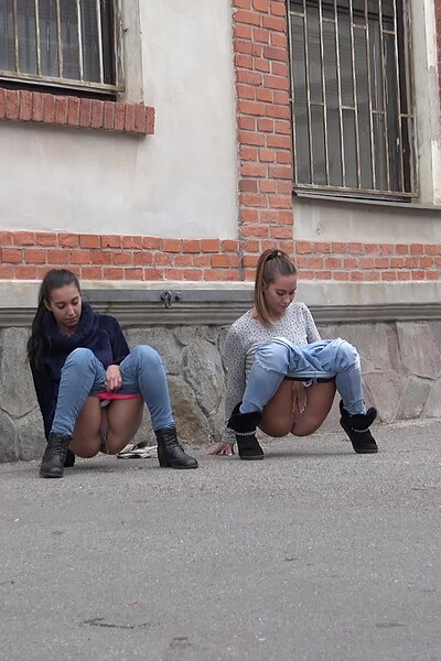 Esperansa and Naomi Benet pull down their jeans and squat side by side, their golden piss streaming onto the ground.
