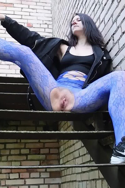 Alice Wu spreads her legs in a crotchless bodystocking and squats, spraying bursts of her piss down the steps.